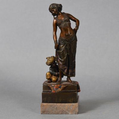 bronze statue of a woman with a child on a marble base