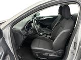 the interior of a car with the door open and the driver ' s seat down