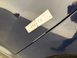 a sticker on the hood of a black car
