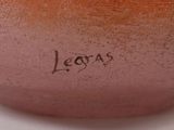 a close up of a vase with the word las written on it