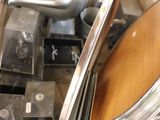 a lot of kitchen utensils in a box on the counter