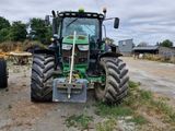 a tractor that is parked on the side of the road
