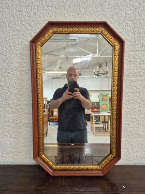 a man taking a picture of himself in a mirror