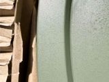 a close up of a toilet with a paper towel on it