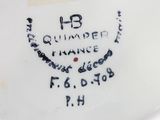 a close up of a white plate with black writing on it