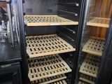 a glass case with trays of food inside of it
