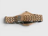 an image of a close up of a wooden watch on a white surface