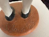 a horse that is standing on top of a wooden stand