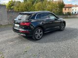the rear end of a black audi suv parked in a parking lot