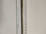 a close up of a thermometer on a refrigerator door