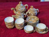 many cups and saucers that are on a table