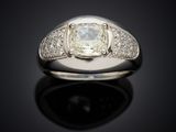 a close up of a ring with a diamond on a black surface