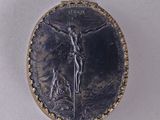 an image of a medal with a jesus on it