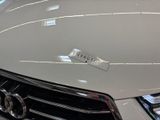 a close up of a car ' s hood with a sticker on it