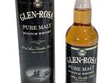une bouteille de whisky pur malt Glen Ross à côté d'une boîte noire