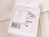 a label on the back of a white shirt