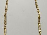 a gold necklace with a chain that has been linked to it