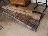 a rug on the floor next to a dresser