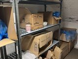 boxes are stacked on a shelf in a room with a lot of boxes