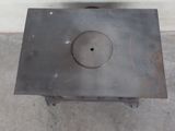 a metal box with a hole in the middle of it