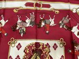 an image of a red and white shirt with a picture of knights on it