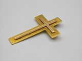 a gold cross on a white background