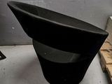 a black chair that is sitting in a room