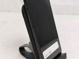 a cell phone that is sitting on top of a stand