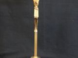 a gold crucifix with a cross on a black background
