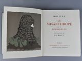 an open book with a picture of a woman made of grapes