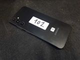 a close up of a cell phone on a black surface