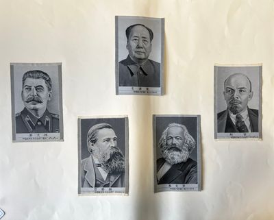 five portraits of men with beards and mustaches on a wall