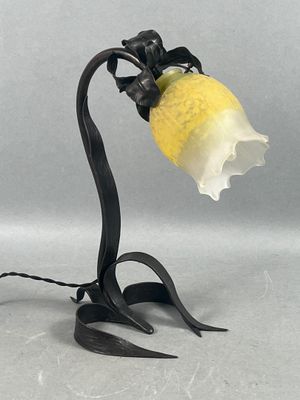 an image of a lamp with a flower on it