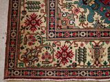 an image of a rug on the floor with a cat laying on top of it