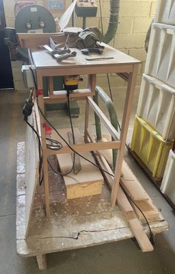 a picture of a workbench in a workshop with tools on it