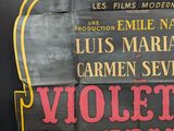 a sign that says violett imperial on the side of a building