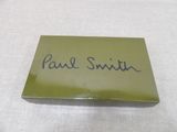 the name of paul smith is on a green business card