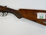 a winchester rifle with a wooden barrel and a wooden case