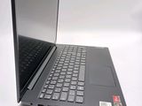 a black laptop with a black keyboard on a white surface