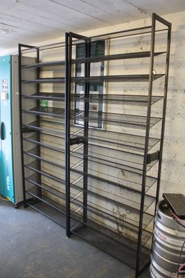 a room with a bunch of shelves and a blue door