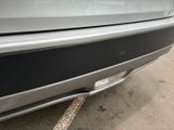 a close up of a car ' s rear bumper