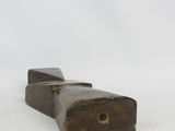 a piece of wood that is sitting on the ground
