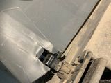 a close up of a car door handle with a metal latch