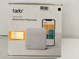 a white box with a smart thermosta on top of it