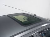 a car that is parked in a garage with a radio on the roof
