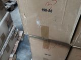 a large stack of boxes sitting on a pallet in a warehouse