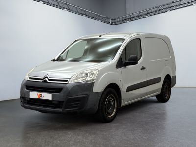 the white van is parked in the garage of the building