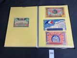 three different types of currency are on display in a folder