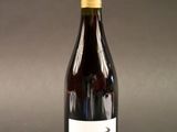 a bottle of wine that is sitting on a table