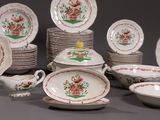 a lot of plates and bowls that are sitting on a table